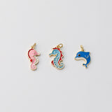 Colgante de delfín/caballito de mar, dijes de vida marina esmaltados, chapados en oro de 18 quilates, para hacer pulseras y collares, accesorios de joyería S1410